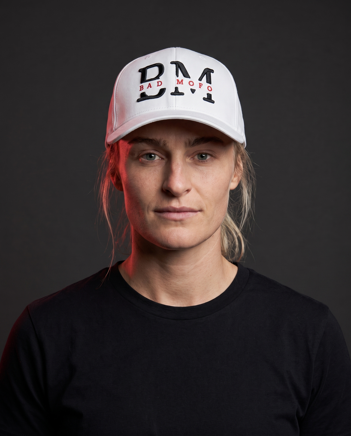 White BM New Logo hat on model - studio