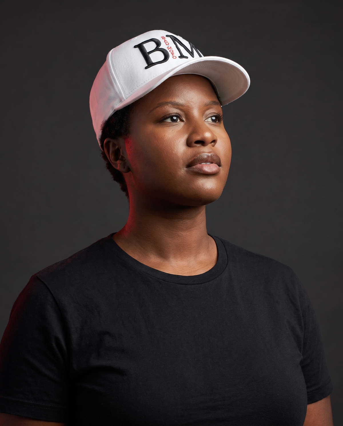 White BM fitted hat on model - studio